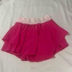 This Skirt Is So Cute And In Really Good Condition. It Is An Old Lulu Color That Is Super Pretty And Isn’t Sold Anymore. Almost Brand New Condition Only Worn And Washed Once. #Pinklulu #Lululemon #Rare #Rarelululemon Pink Summer Tennis Skirt For Workout, Pink Tennis Skirt For Summer Workout, Sporty Pink Skirted Bottoms, Pink Mini Skirt For Sports In Spring, Sporty Pink Mini Skirt For Sports, Pink Casual Workout Skirt, Casual Pink Workout Skirt, Athleisure Pink Swim Skirt With Built-in Shorts, Pink Sports Skirt With Lining