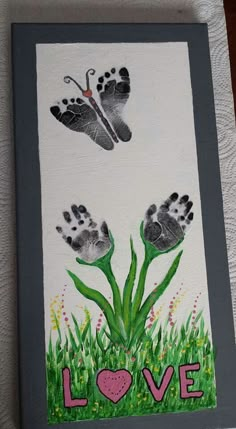 an image of two hand prints in the grass with butterflies flying above them on a facebook page