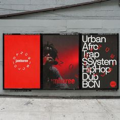 two billboards on the side of a building with red and black graphics above them