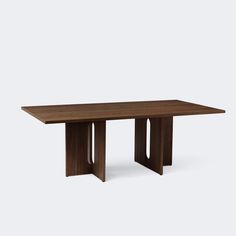 a wooden table with two intersecting legs and a rectangular top, against a white background