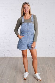 Get ready for a playful weekend with our Ramona Overalls. These cuffed denim overall shorts are in a light wash denim color and are perfect for a casual look. With adjustable straps and multiple pockets, these overalls have both style and functionality. They feature five pockets on the front and two on the back, button closures on each side, belts loops, and adjustable and removable straps. Don't miss out on these fun and versatile overalls! They are lightweight and fit true to size. 100% Cotton Spring Medium Wash Overalls With Adjustable Straps, Summer Overalls With Adjustable Straps In Medium Wash, Medium Wash Overalls With Adjustable Straps For Summer, Summer Medium Wash Overalls With Adjustable Straps, Casual Washed Denim Shortalls, Summer Denim Overalls With Adjustable Straps, Relaxed Fit Denim Shortalls In Medium Wash, Casual Light Wash Shortalls For Summer, Casual Denim Overalls In Short Length