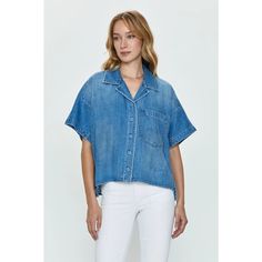 Relaxed Fit, Short Sleeve Denim Shirt With A Camp Collar Neckline And Exaggerated, Dropped Shoulders. Constructed With A High-Low Split Crop Length, And Crafted From A Clean, Medium Blue Denim Wash. * 62% Cotton / 38% Cotton Lyocell * Dry Clean Light Wash Button-up Top With Frayed Hem, Medium Wash Short Sleeve Denim Jacket For Summer, Relaxed Fit Washed Tencel Tops, Light Wash Relaxed Fit Denim Top, Light Wash Collared Denim Top, Casual Cropped Blouse With Pockets, Summer Denim Collared Blouse, Summer Collared Denim Blouse, Denim Tops With Pockets In Medium Wash