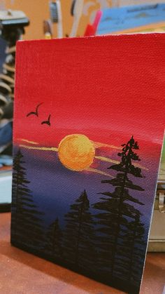 an acrylic painting of a sunset with pine trees