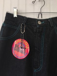 "Rare NWT Vintage Early 80s High Waisted Black Denim Jean Skirt, by Jou Jou. New condition and unworn with original tags. Awesome Knee Length Skirt with Super high rise waist. Front & back pleated down center of leg. Black denim with turquoise stitching. Brand - Jou Jou Condition - Original. Deadstock from the 80s, New with original tags. 100% Cotton Machine Washable Made in USA Vintage Size - 7/8 Size - 26\" waist Best Fits Size 25-26\" waist *please see measurements* has stretch * Measurem Fitted Blue Denim Skirt For Streetwear, 90s High Waist Blue Denim Skirt, 90s High-waist Blue Denim Skirt, Retro Blue Cotton Denim Skirt, 90s Style Fitted Blue Denim Skirt, 90s Style Blue Denim Summer Skirt, Fitted Blue Denim Skirt 90s Style, Blue Fitted 90s Denim Skirt, Blue Retro Denim Skirt