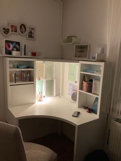 a corner desk with an open book shelf