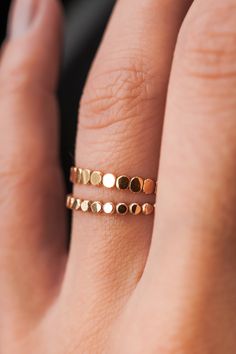 This stacking ring is perfect for mixing and matching! Either wear several at once or mix some in with your favorite rings for extra width and sparkle! This new version of the Bead Ring is slightly more durable than its predecessor! This listing is for ONE SINGLE ring.This ring is made out of 14K GOLD FILL metal.The finish is lightly faceted/hammered.* The photos show this new Mini Bead Ring style compared to our Original Bead Ring! Each Mini Bead Ring is individually cut, soldered and polished Adjustable 14k Gold Double Band Ring, Stackable Rose Gold Midi Rings With Open Band, Adjustable Double Band 14k Gold Ring, Stackable Rose Gold Open Band Midi Rings, Rose Gold Stackable Midi Rings With Open Band, Adjustable Gold Rings For Layering, 14k Gold Stackable Toe Rings, 14k Gold-filled Stackable Midi Rings With Open Shape, 14k Gold Filled Stackable Midi Open Rings