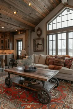 a living room filled with furniture and a large window covered in wooden planks on the ceiling