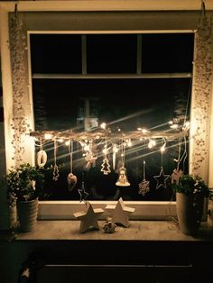 a window sill filled with christmas decorations and lights