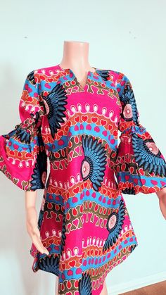 African ladies Dress Fitted V-neck Blouse With Vibrant Print, Casual Multicolor Bell Sleeve Dress, Vibrant Print Knee-length Midi Dress, Knee-length Summer Blouse, Summer Midi Dress With Bell Sleeves, Pink Fitted Bell Sleeve Dress, Pink Fitted Dress With Bell Sleeves, Fitted Bell Sleeve Blouse, Fitted Blouse With Vibrant Print For Day Out