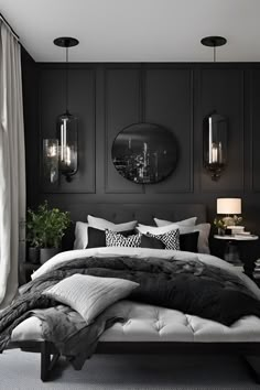 a bedroom with black walls and white bedding, two round mirrors above the bed