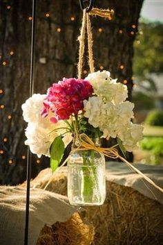 a vase filled with flowers sitting on top of a table