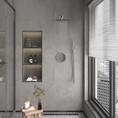 a modern bathroom with grey walls and white tile flooring, along with an open shower head