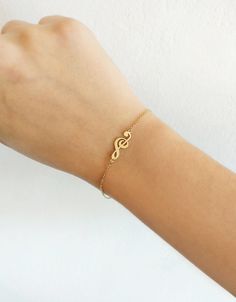 "14K 9K Gold Music Note Bracelet, Treble Clef Charm Bracelet, Dainty Music Note Bracelet, Solid Gold Bracelet, Musician Gift, Music Lover Gift, Christmas Gift, FREE EXPRESS SHIPPING Beautiful and delicate bracelet with a treble clef/note charm made in 14K or 9K solid gold. \"Music gives a soul to the universe, wings to the mind, flight to the imagination and life to everything.\" -- Plato Whisper...I love Music! -------------------------------------------------- D E T A I L S 14K Solid Gold or 9 Musical Note Bracelet, Music-themed Bracelet Jewelry Gift, Personalized Jewelry Band For Gift, Personalized Band Jewelry For Gift, Music-themed Band Jewelry As Gift, Music-themed Band Jewelry Gift, Music Note Bracelet, Music Bracelet, Delicate Gold Bracelet