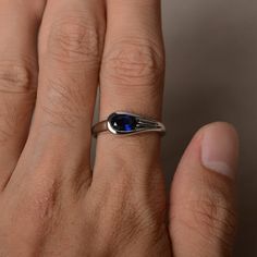 This is a gorgeous handmade creation. Its beauty is its simplicity & Elegance. The 5*7 mm oval shape faceted lab sapphire is crafted in solid sterling silver and with rhodium plated. All item is sent in a beautiful gift box If you have any idea of design your ring,pls contact me directly. You can realize more lovely stuff clicking the link https://www.etsy.com/shop/knightjewelry?refshopsection_shophome_leftnav Please leave the correct address and you phone number for delivering successfully. Oval Faceted Sapphire Ring Fine Jewelry, Elegant Oval Faceted Sapphire Ring, Oval Cabochon Sapphire Promise Ring, Oval Faceted Sapphire Ring For Formal Occasions, Minimalist Sapphire Oval Birthstone Ring, Minimalist Oval Sapphire Birthstone Ring, Modern Lab-created Sapphire Ring As Gift, Minimalist Oval Sapphire Ring, Gift Sapphire Oval Cabochon Ring With Polished Finish