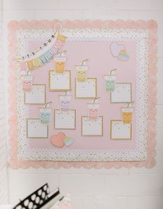 a pink and gold baby shower wall hanging on the wall