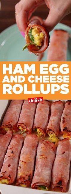 ham egg and cheese rolls on a plate with a person dipping them into the roll