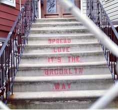 some stairs with graffiti written on them and the words spread love it's the brooklyn way