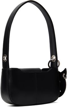 Handcrafted faux-leather shoulder bag in black. · Fixed shoulder strap · Detachable graphic charm at shoulder strap · Magnetic press-stud flap · Broadcloth lining · H4.25 x W8 x D2 Supplier color: Black Evening Black Bucket Bag With Metal Hardware, Black Baguette Bag With Metal Hardware For Office, Black Bucket Bag With Top Handle And Metal Hardware, Black Square Shoulder Bag With Detachable Strap, Evening Tote Flap Bag With Adjustable Strap, Double Handle Leather Baguette Bag With Metal Hardware, Square Shoulder Bag With Metal Hardware For Daily Use, Trendy Evening Bucket Bag With Metal Hardware, Trendy Leather Baguette Bag With Silver-tone Hardware