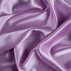 a close up view of a purple satin fabric