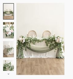 the table is decorated with white flowers and greenery