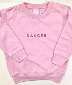 Have your little one show off their passion for dance with this sturdy and warm sweatshirt anytime they're not at the dance studio. Great for looking adorable during dance class too! 60% cotton, 40% polyester Coverstitched collar Ribbed cuffs and waistband Dance Studio Merch, Cute Dance Outfits, Hoodie Wishlist, Dance Shirts Ideas, Dance Sweatshirt, Dance Things, Balloon Cars, Class Birthdays, Dance Comp