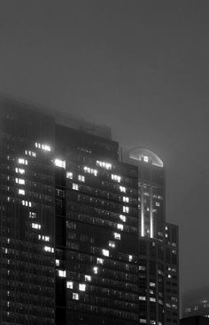 the words jeffy ebbeling are lit up in front of some tall buildings