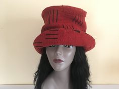 "This is a wide-brim cloche hat made of soft luxurious, perfectly imperfect, Mud Cloth with black designs throughout.  Its red and black color is rare and therefore, all the more desirable.  It has understated elegance in style and can be worn, for any occasion during any season.  Both women and men can rock this style hat!  It is versatile and its look can be changed simply by your mood.  The hat is one of a kind, but it can be made for you in, either a variety of red and black prints, or a different color.  Currently, because of the extremely limited availability of this specific red and black pattern, the fabric, if accessible, is quite costly. - Handmade - Mud Cloth - Black satiny lining -Warm interfacing  - Generous sizing will accommodate big hairdos To personalize your hat for the b Red Fedora Winter Hat, Red Winter Fedora, Red Fedora For Winter, Fitted Red Hat With Curved Brim, Red Top Hat With Flat Brim, Fitted Red Hats With Curved Brim, Red Brimmed Top Hat For Winter, Red Wide Brim Winter Hat, Red Brimmed Costume Hat One Size