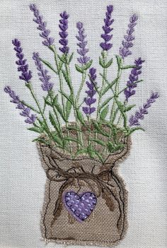 a bag filled with lavender flowers sitting on top of a table