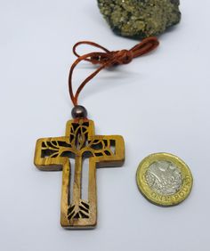 Handmade Cross Pendant, Olive Tree Cross Symbol, Good Luck and Protection Talisman, Gift Religious Necklace We cut the olive tree with a clay saw and made a necklace. It is completely handmade; Birthday, mothers Day, Valentine's Day, You may also want to pamper yourself. Or it is very suitable for you as a gift on a special day. I take pictures of the products with the phone camera, the colors may be a little different due to the camera quality difference. For gift, please let me know, Please le Artisan Cross Pendant Necklace As Gift, Brown Cross Pendant Necklace For Gift, Brown Cross Pendant Necklace As Gift, Brown Spiritual Necklace With Cross Pendant, Protection Talisman, Cross Symbol, Gothic Pendant, Phone Camera, Olive Tree