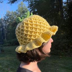 a woman wearing a yellow knitted hat