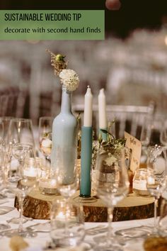 a table with candles and vases on it for a wedding centerpiece that reads, cheap diy wedding centerpiece