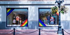 a store front with two rainbow colored windows