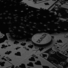 poker chips and playing cards on a table