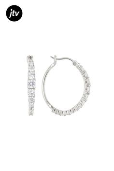 Bella Luce �� white diamond simulant 4.00ctw round, rhodium over sterling silver hoop earrings. Measure approximately 1.13"L x 0.13"W and have saddleback backings. The diamond equivalent weight is 2.28ctw. Oval Cubic Zirconia Hoop Earrings With Diamond Cut, Oval Cubic Zirconia Hoop Earrings Fine Jewelry, White Brilliant Cut Sterling Silver Hoop Earrings, Hypoallergenic Diamond White Cubic Zirconia Hoop Earrings, Hypoallergenic Cubic Zirconia Round Cut Hoop Earrings, Classic White Cubic Zirconia Hoop Earrings, White Cubic Zirconia Hoop Diamond Earrings, White Hoop Jewelry With Channel Set, White Channel Set Hoop Jewelry