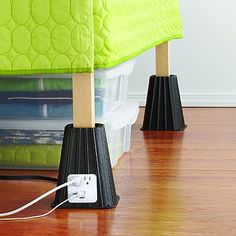 a bed sitting on top of a hard wood floor