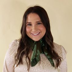 Brunette model wearing a long sleeve, iviry leopard print top with an olive green scarf tied around her neck. This model is pictured in front of a beige background. Classic Spring Scarves For Formal Occasions, Classic Formal Scarves For Spring, Elegant Green Scarf For Formal Occasions, Classic Spring Formal Scarves, Elegant Green Scarves For Party, Chic Solid Color Formal Scarves, Elegant One Size Scarf, Elegant Fall Scarves One Size, Elegant Fall Scarves