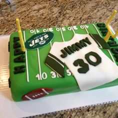 a cake that is shaped like a football jersey