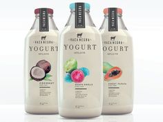 three bottles of yogurt sit side by side