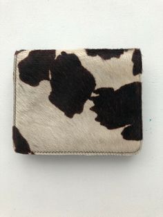 Black And White Pony Hair Cowhide Leather Belt Bag with magnetic closure Never used. Perfect condition. Attaches to any belt. Super stylish. Paid $175.00 Designer Square Wallets For Everyday, Designer Square Wallets, Trendy Beige Leather Wallet, Trendy Leather Rectangular Wallets, Trendy Leather Pouch Wallets, Trendy Rectangular Leather Wallets, Trendy Leather Wallet In Pouch Shape, Trendy Leather Wallet, Rectangular Shape, Casual Leather Wallet As Gift