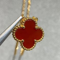 This Clover Pendant Carnelian Necklace is a stunning accessory that adds a touch of elegance to any outfit. Made with high-quality carnelian gemstones, this necklace features a delicate clover pendant that symbolizes good luck and fortune. Elevate your style and channel positive energy with this beautiful necklace. ADDITIONAL INFORMATION Color: Pink Gold, Gold Stone: Carnelian Ref. H121342 Material:- 925 Sterling Silver - 18k Gold Plated- 18k Real Gold ( contact us via instagram) The length of t Elegant Orange Pendant Necklaces, Elegant Orange Pendant Jewelry, Luxury Red Sterling Silver Necklace, Elegant Orange Necklace With Polished Finish, Formal Orange Carnelian Necklace, Yellow Gold Carnelian Jewelry With Polished Finish, Luxury Carnelian Jewelry For Formal Occasions, Elegant Orange Carnelian Jewelry, Gold Carnelian Jewelry With Polished Finish