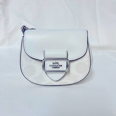 Signature Coated Canvas And Smooth Leather Inside Multifunction Pocket Snap Closure, Fabric Lining Detachable Chain Strap With 23 1/4" Drop For Shoulder Or Crossbody Wear 5" (L) X 3 3/4" (H) X 2 1/4" (W) Style No. Ck439 Color: Silver/Chalk/Glacier White Classic White Leather Wallet On Chain, White Leather Classic Wallet On Chain, Chic White Wallet On Chain For Everyday, Luxury White Wallet On Chain, Coach Wallet On Chain For Everyday Use, Coach Wallets With Chain Strap For Everyday Use, Wallet On Chain With Branded Hardware For Everyday Use, Coach Wallet On Chain With Details, Classic White Bag With Chain