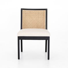 a black and white chair with a beige seat cover on it's back end