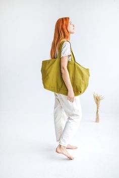 "FREE EXPRESS DELIVERY FOR ALL ORDERS OVER 60 EUR! (2-7 working days) FedEx, UPS, GLS, DPD. This large linen bag is perfect for a long-awaited summer holiday, picnic, or trip to the beach. Made of soft heavyweight linen that feels lovely to the touch. Roomy enough for large towels along with other essentials. The bag has an extra linen lining, so it can easily withstand heavier items. * Which is your favorite color? Olive / Ocean / Terracotta. Beach bag approx. size: Height: 35 cm / 14\" Length: Green Canvas Shoulder Bag For Beach, Summer Khaki Tote Beach Bag, Green Canvas Bag For Summer Vacation, Green Canvas Bags For Summer, Summer Travel Bag Made Of Linen, Cotton Weekender Bag For Everyday Summer Use, Summer Cotton Weekender Bag For Everyday, Summer Large Capacity Green Canvas Bag, Green Canvas Beach Bag For Summer