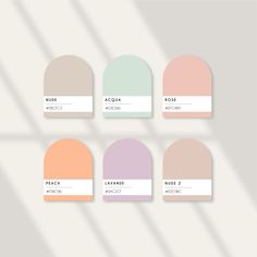 six shades of pastel paint with the names of each color in different sizes and shapes