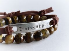 "Wear your favorite inspirational words on your wrist to remind yourself of what matters most to you every day. :) This unisex bracelet features the bible verse \"Isaiah 41:10\", hand stamped into non tarnish stainless steel, with a small cross at the end of the verse. The soft brown faux suede leather cord is adjustable and fits most wrist sizes. You can choose any other short verse you would like under \"personalization\", up to 10 letters works best with this design, but I can squeeze up to 1 Inspirational Custom Name Adjustable Bracelet, Inspirational Personalized Faith Name Bracelet, Spiritual Leather Bracelet For Everyday, Spiritual Everyday Leather Bracelet, Spiritual Adjustable Hand Stamped Bracelets, Inspirational Engraved Adjustable Name Bracelet, Adjustable Spiritual Hand Stamped Bracelets, Brown Hand Stamped Bracelets For Everyday, Inspirational Engraved Name Bracelet, Adjustable