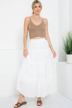 Introducing our Coastal Tiered Maxi Skirt, designed to bring the essence of seaside charm to your wardrobe. Crafted with care and inspired by the tranquility of coastal living, this skirt is the epitome of effortless elegance and relaxed sophistication. Pair it with a simple tank top for a laid-back beach look, or wear it for chillier days with our beachcomber sweater or cardigan. Whether you're exploring new destinations or simply enjoying a leisurely day in town, our Coastal Tiered Maxi Skirt promises to add a touch of seaside charm to any ensemble. Dive into relaxation and style with this versatile wardrobe staple. Details: 100% Polyester Fully Lined Elastic Stretch Waistband w/ Tie True to Size Fit Simple Tank Tops, Tiered Maxi Skirt, Versatile Wardrobe, Beach Combing, Effortless Elegance, Beach Look, Coastal Living, Wardrobe Staples, Relaxation