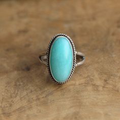 The color of this bright, aqua blue Amazonite ring is breathtaking. This beautiful Amazonite ring just levitates with the crisp mint color of natural Amazonite. The Boho Ring design looks and feels like it was made by a master silversmith from another time. Here in stunning, robin's egg blue Amazonite. Here you will get the turquoise color you want -- even better to some -- without the cost. The boho, classic design with the .925 Sterling Silver twist wire and double, half-round split shank make Silversmith Rings, London Topaz Ring, Big Statement Rings, Gold Wave Ring, Mens Skull Rings, Amazonite Ring, Oxidized Silver Rings, Silver Wrap Ring, Robin's Egg Blue