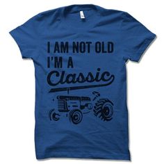 I'm Not Old I'm A Classic 'Tractor' short-sleeve crewneck t-shirt. Unisex Fit. Printed with eco-friendly water-based inks. Please refer to the size chart in the last image of the listing (laying flat measurements in inches). Due to the calibration differences between computer monitors, phone screens and tablets, the actual product color may vary slightly from what you are viewing. SHIRT FEATURES: - 4.2 oz., Solid color tees (red, white, blue, green) are 100% combed and ringspun cotton, 30 single Classic Short Sleeve Birthday T-shirt, Classic Letter Print T-shirt For Birthday, Classic T-shirt With Letter Print For Birthday, Classic Birthday T-shirt With Letter Print, Classic Graphic Print T-shirt For Birthday, Classic Blue T-shirt With Letter Print, Farmer Tshirt Ideas, Tractor 2nd Birthday Party Shirt, Three Tractor Shirt