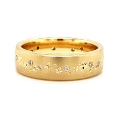 This beautiful band is crafted in buttery 14K yellow gold, the sand-blasted finish creating a matte surface that seems to glow, glittering diamonds interspersed with perfectly hand-engraved stars, planets, and moons running down the center. Wear this as a fashionable wedding band or add it to a stack of your favorite rings! Cold Hard Facts: metal: 14K yellow gold gem: (13) round brilliant cut white diamonds - 0.20ctw (G-H, SI1) shank width: approx. 6mm finger size: 6.5 Celestial Wedding Band, Planets And Moons, Celestial Ring, Bozeman Mt, Star And Moon, Yellow Gold Diamond Ring, Diamond Glitter, Gold Diamond Ring, I Feel Pretty