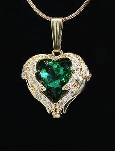 Stunning EMERALD GREEN CZ Heart Charm Necklace  ☆ High Quality GREEN Cubic Zirconium ☆ Gift for Her  ☆ For Mom | Daughter Gift ☆ Green Heart Charm Necklace ☆ Minimalist Heart Charm Necklace ☆ A lovely dainty GREEN heart     outlined with angel wings of     Gold and embellished with     Tiny cubic zirconium on the wings ☆ HEART measures 15mm x 15mm ☆ Strung on a Gold Snake Chain       45 cm/ 17.7 inches long       with lobster clasp. ☆ Eco Gift Packaged in a Gold Foil      Gift Box & Reusable      Decorative Gift Bag ☆ Ready for Gifting! ☆ Ships same day as ordered to USA. This HEART is ALSO available in MANY other colors. GO HERE: https://www.etsy.com/listing/1278992479/exquisite-cz-heart-charm-necklace-in-8 Happy Heart Healing! Green Heart Necklace, Mom Daughter Gifts, Angel Wings Heart, Gold Heart Locket, Gold Snake Chain, Necklace Emerald, Lucky Jewelry, Heart Healing, Heart Charm Necklace